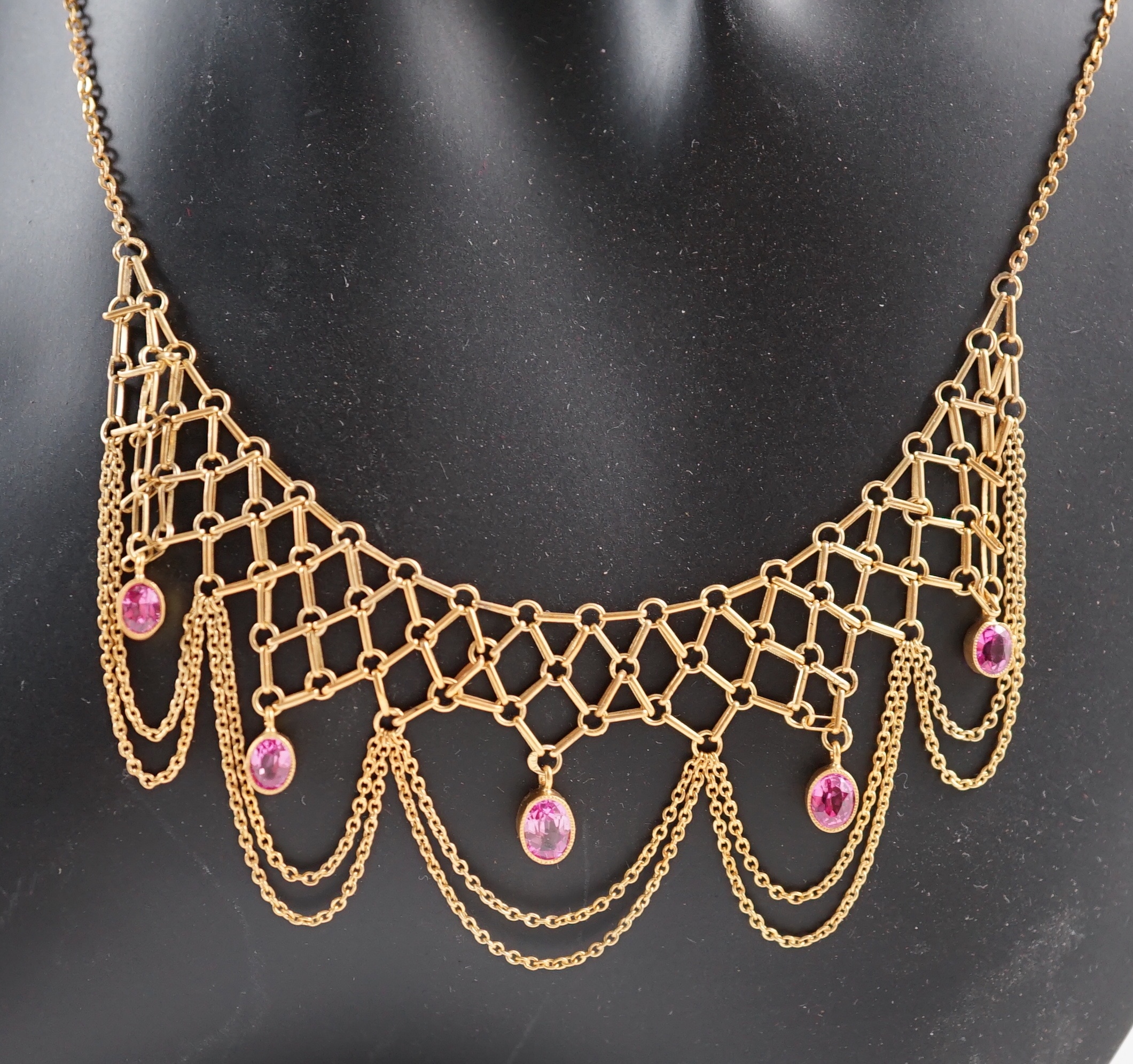 A 20th century 14k gold and five stone oval cut pink topaz set drop fringe necklace